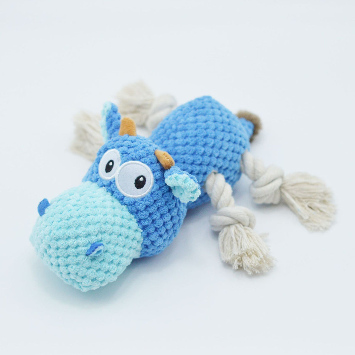 Close-up of plush dog toy filling and lining