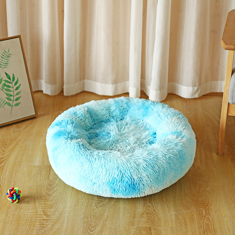 Round pet bed shown in a room setting