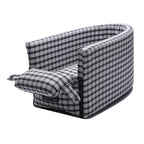 Small dog or cat resting inside pet car armrest box kennel