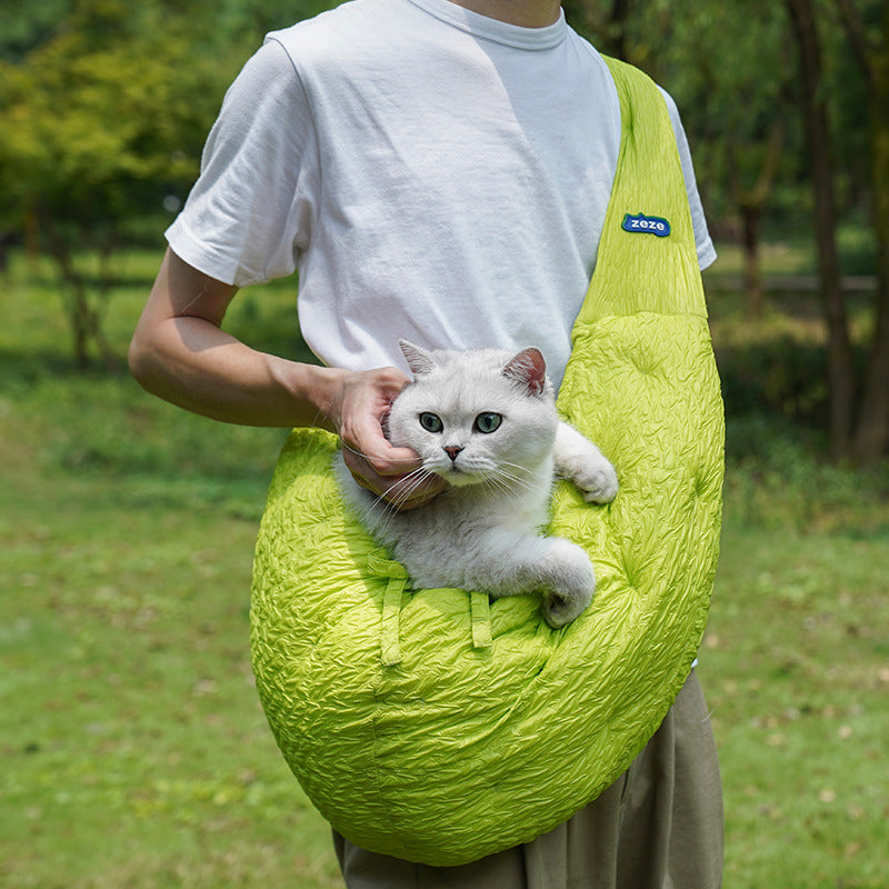 Green pet carrier bag with pet inside